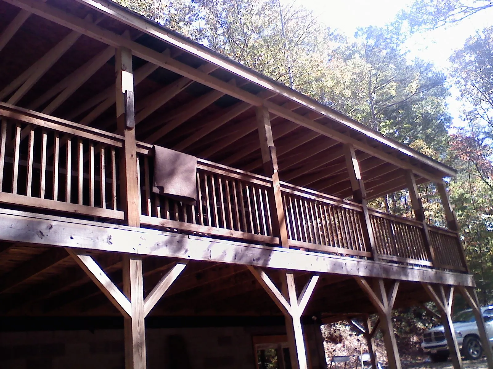 Timber framing under a new elevated porch and deck — Roof Leak Repair in Check by Roofing Brothers